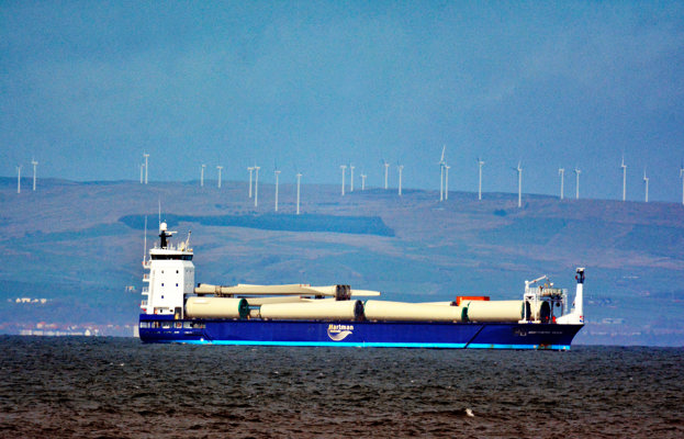 Wind turbines on the move with a distant windfarm on the Ayrshire Coast in the background.