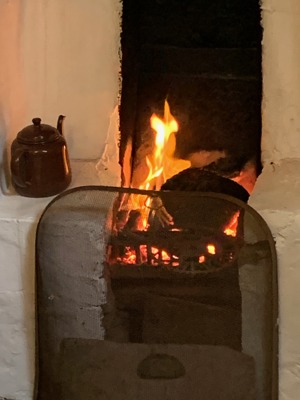 Blackhouse hearth with a peat fire