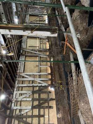 The image shows conservation repair of rowing boathouse timber frame on Glasgow Green.