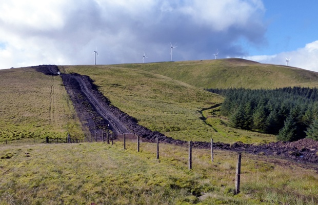 A bulldozed road and wind turbines on Windy Standard