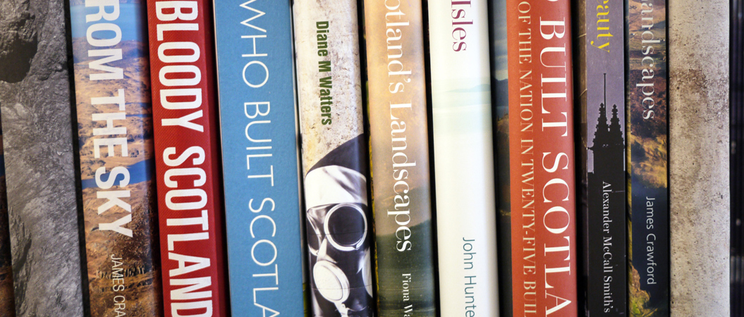 Various books about Scotland standing on a shelf