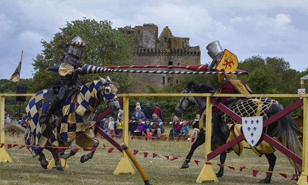 Two Knights on horseback with jousts charging towards each other