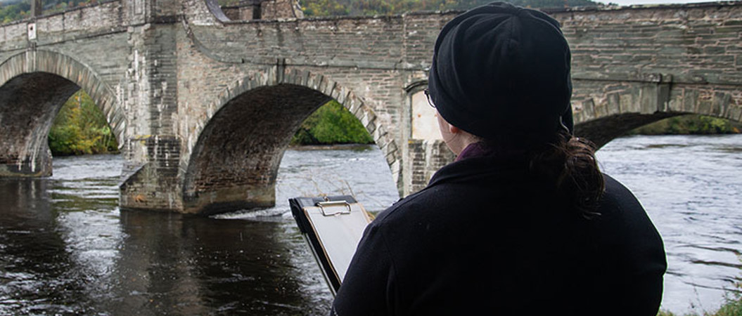 A trainee surveying sections of 18th century military road heritage in Highland Perthshire, including the Wade Bridge in Aberfeldy, Perthshire