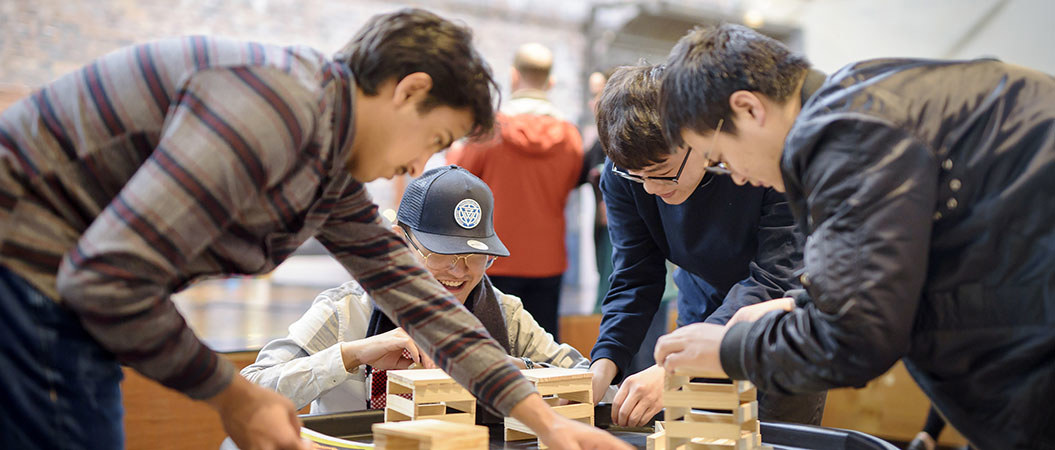 Students at the Engine Shed using wood to create constructions