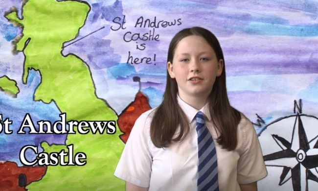 Girl in front of drawing of Scotland and the text St Andrews Castle