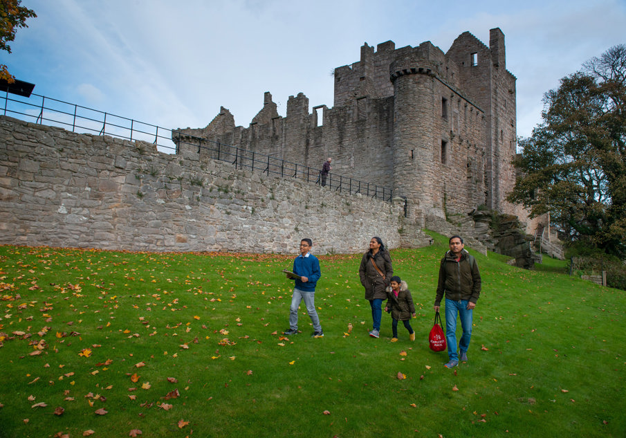 A family enjoying a visit to Craigmillar Castle