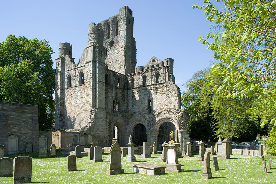 A semi-ruined stone abbey and graveyard. Image reference number: DP_008770