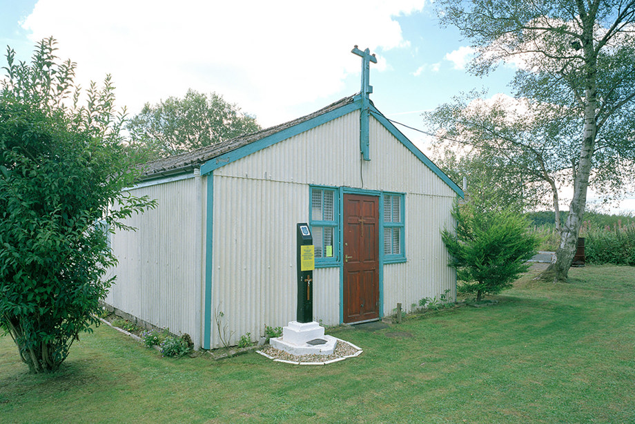 A small, white corrugated iron chapel in the countryside. Image reference number: SC_1368640