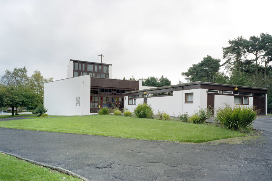A modern, rectangular church with a wall made up of small, brightly coloured windows. Reference no: SC_713562