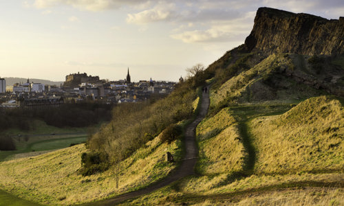 A large, rocky crag in a park