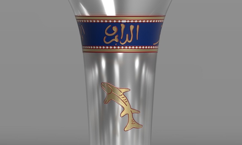 A 3D model of what the original drinking beaker of the found glass might have looked like. It has a vase-shape form and a blue and gold line below the rim with Arabic writing on it. It is also decorated with a golden fish.