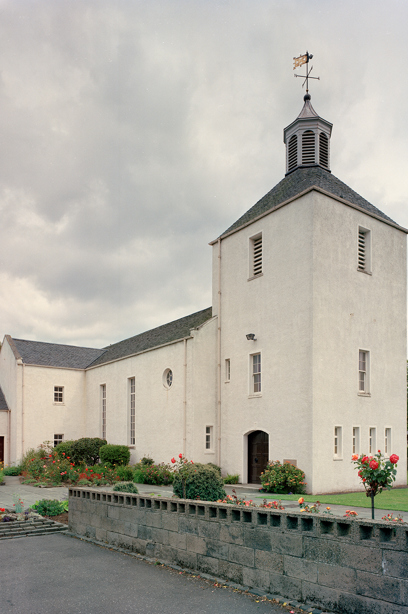 A traditional, white lime harled church with a slate roof. Image reference number: SC_440071
