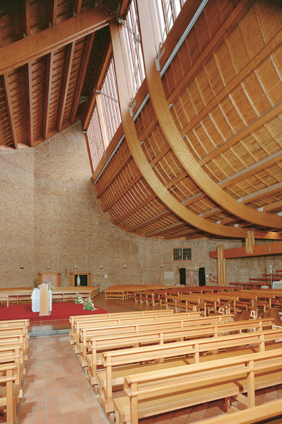 A church with wooden pews and an unusual low, curved wooden ceiling. Image reference number: SC_358261