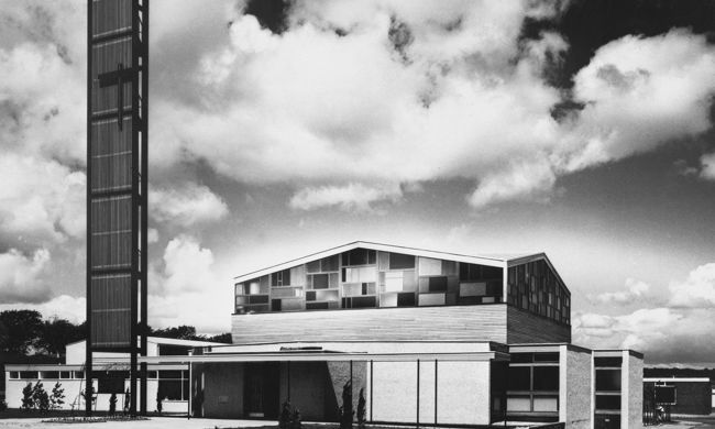 An angular, modernist church with an expanse of glass windows SC_441408