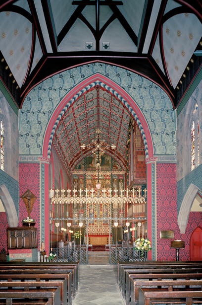 The inside of a church with bright pink and blue patterned walls and tall, decorative roof. Reference no: SC_1250849