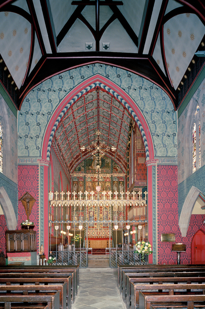 The inside of a church with bright pink and blue patterned walls and tall, decorative roof. Reference no: SC_1250849