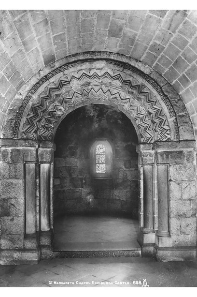 A decoratively carved stone entrance to a chapel