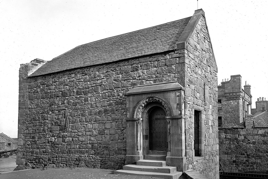 A modest, historic stone chapel with a slate roof