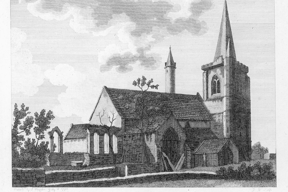 A cathedral with a tall spire and round tower
