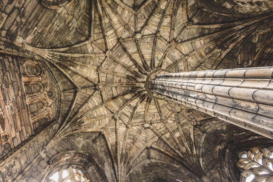 An intricately carved, tall stone ceiling