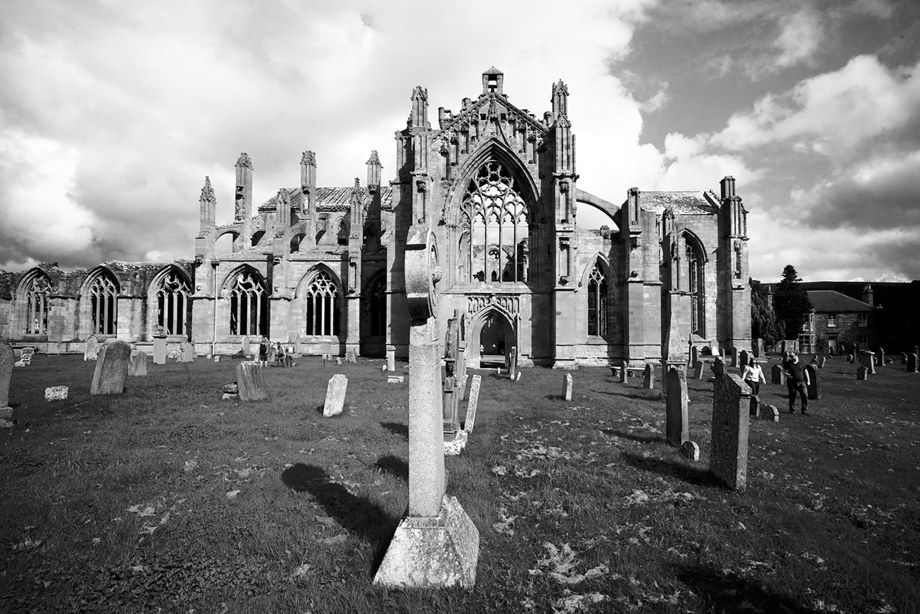 A beautifully stone carved, gothic abbey and graveyard