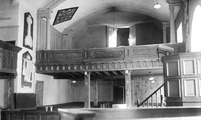 A wooden balcony inside a church SC_1223775