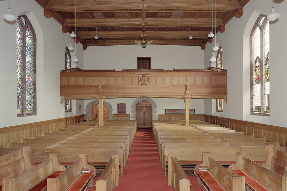 A small church with wooden pews, a wooden ceiling and a wooden balcony. Reference no: SC_1145318