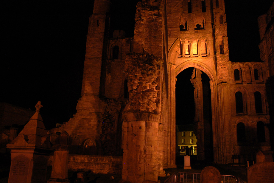 A stone historic abbey ruin in the darkness