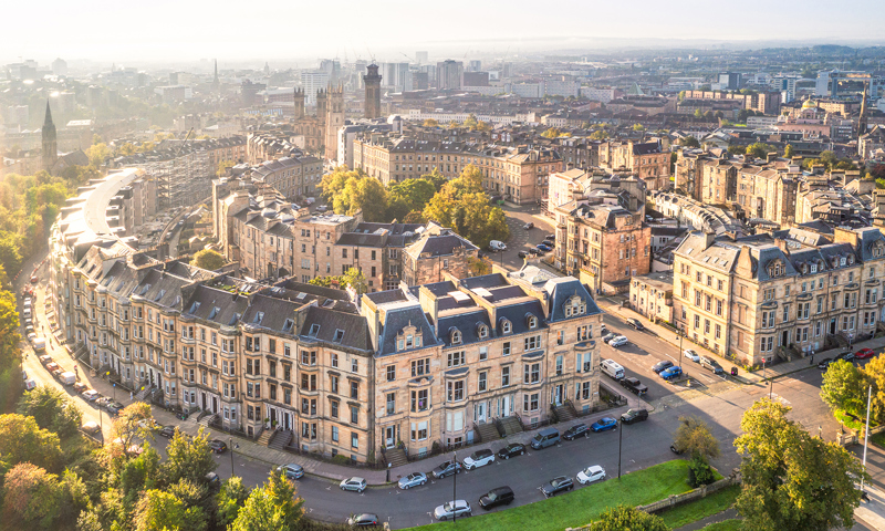 An aerial view of a light stone tenements buildings in Kelvingrove, Glasgow