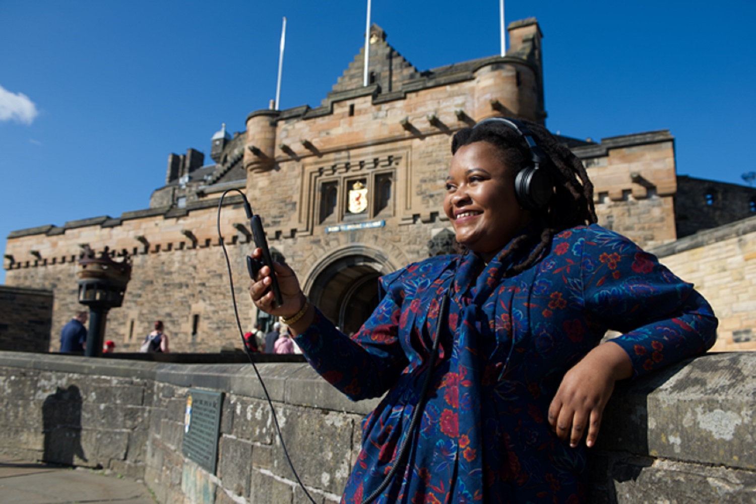 Artist Tanatsei Gambura standing outside Edinburgh Castle 