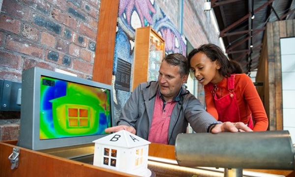 A man and girl looking at a screen showing thermal imaging
