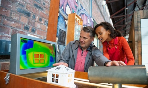 A man and girl looking at a screen showing thermal imaging