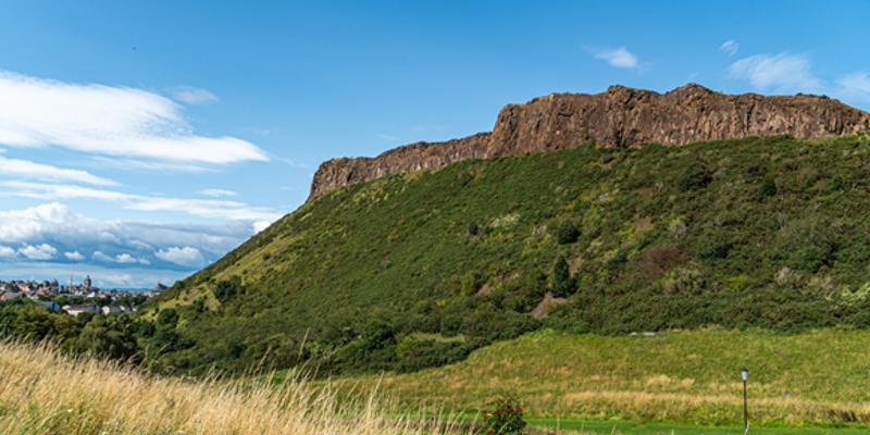 An image of Holyrood Park with Salisbury Crags in the background