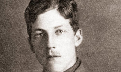 A person with a small moustache and wearing a soldier
