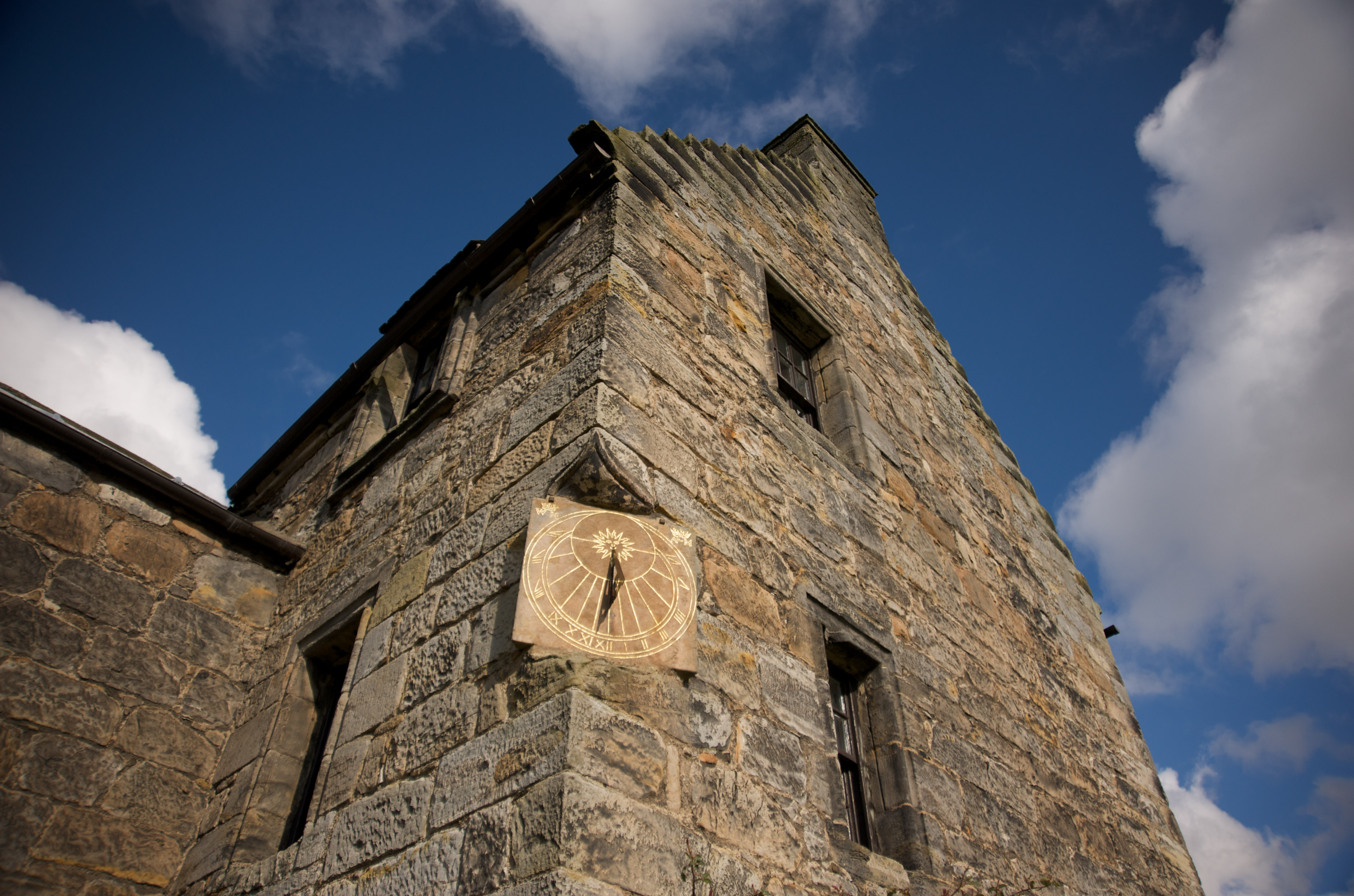A sundial built into the wall of a castle