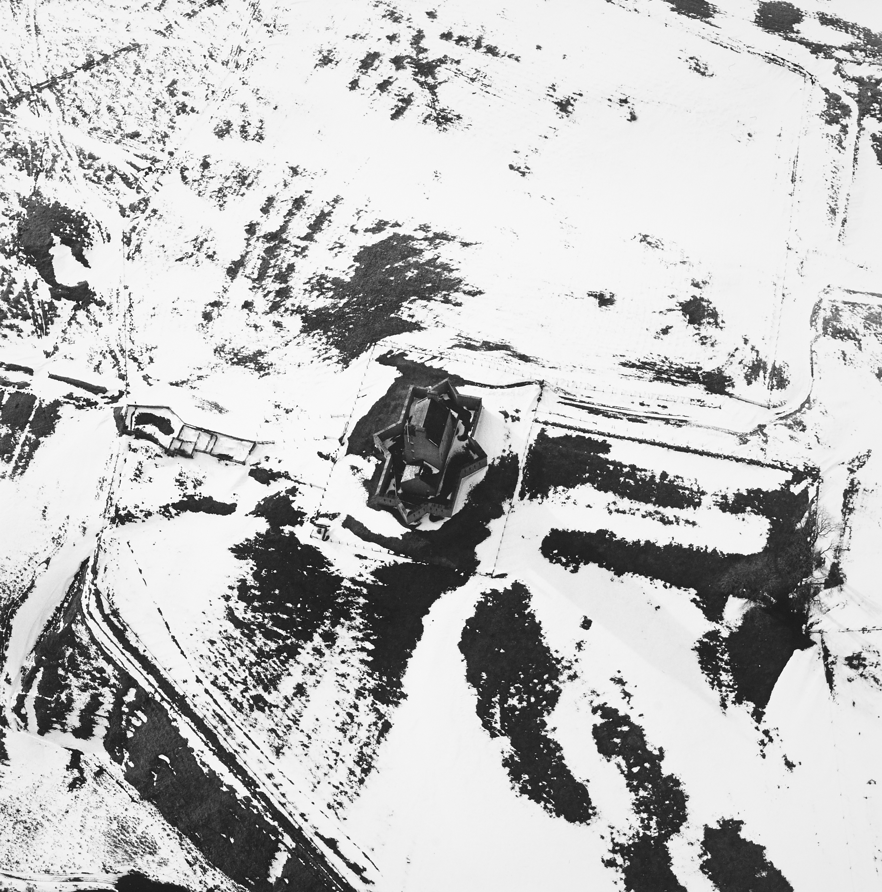 Aerial view of a star-shaped building in the snow