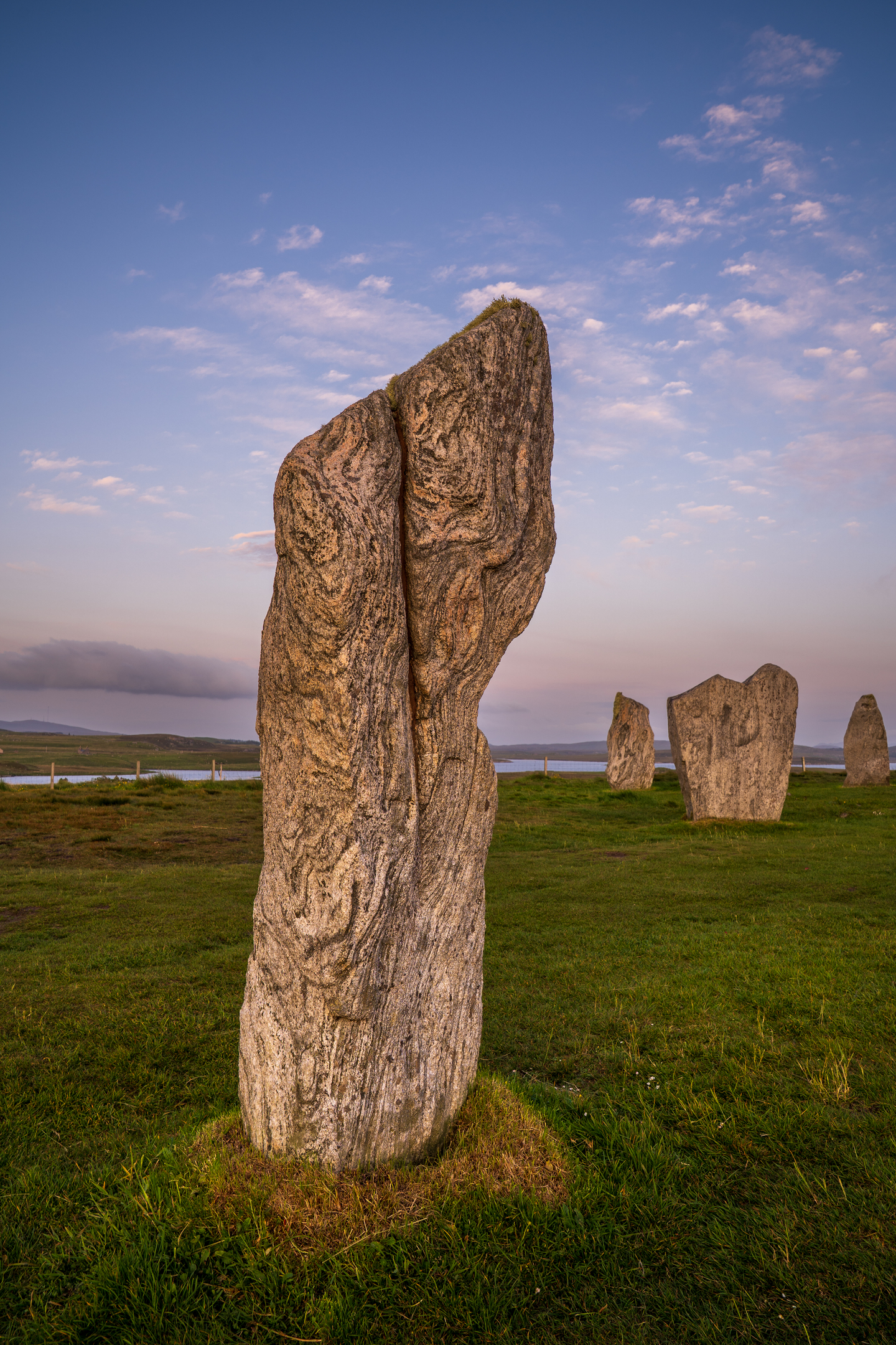 Close view of a textured Calanais stone illuminated by soft morning light.