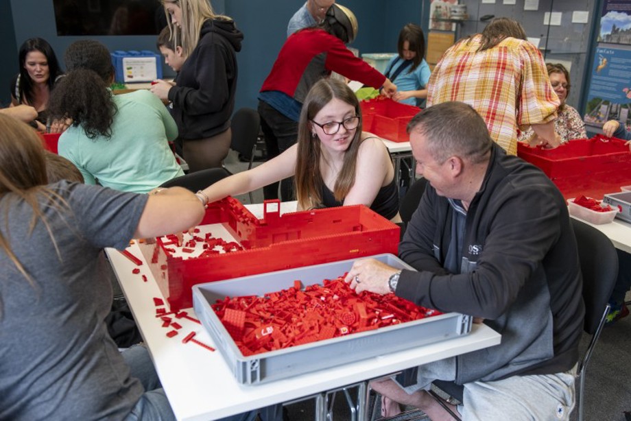 A group of learners building one of our sites with LEGO bricks