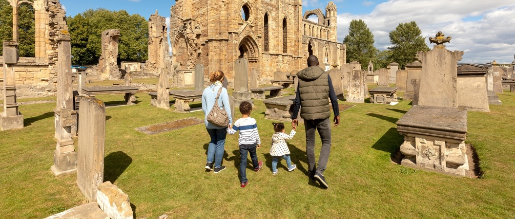 A family on a day out at a castle ruin
