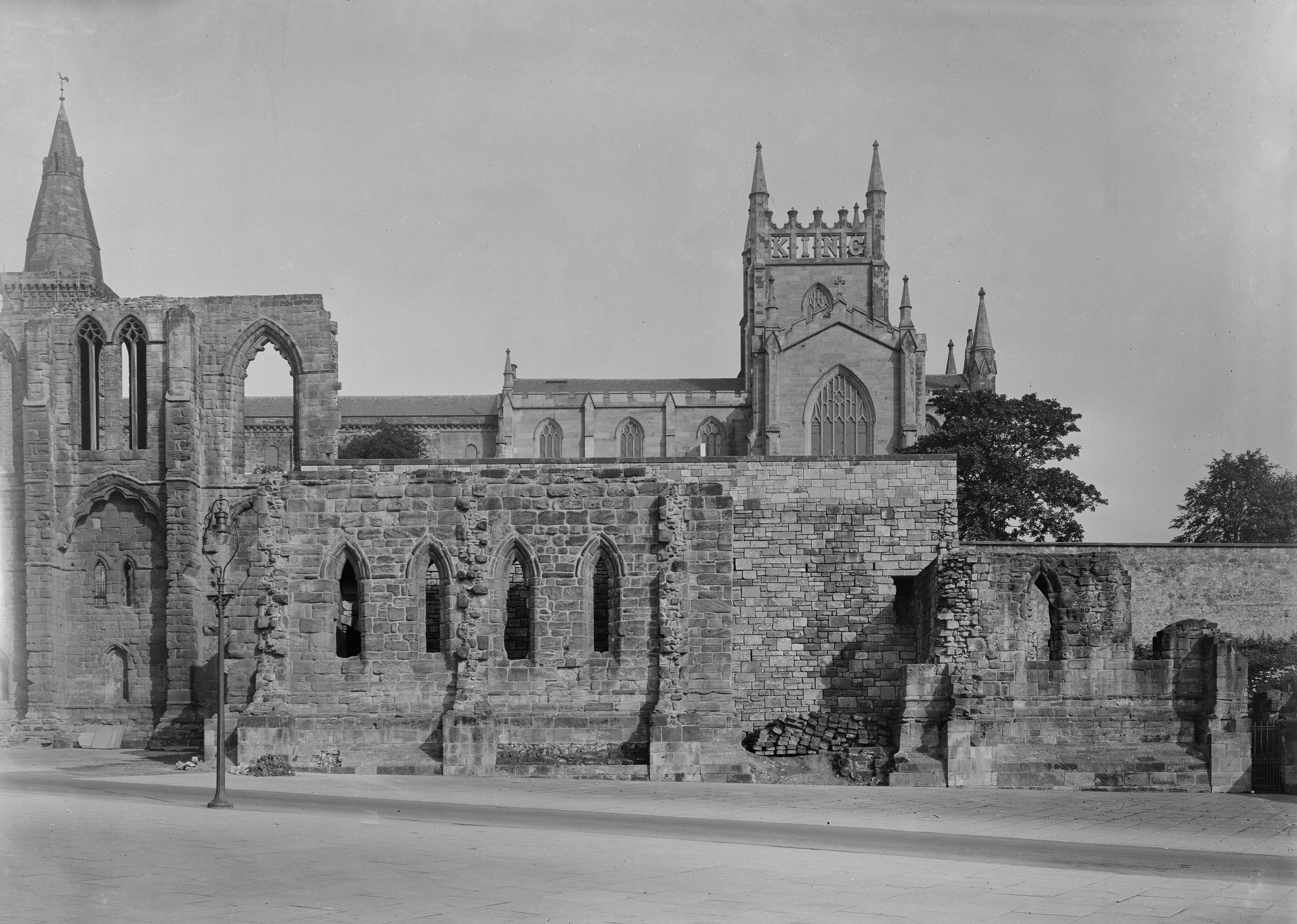 General view of well-preserved abbey ruin with still operating main body of abbey in distance