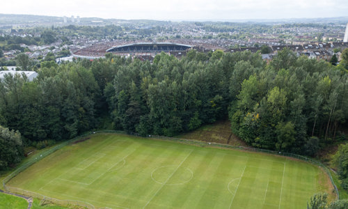 Aerial view of a large park and football stadium