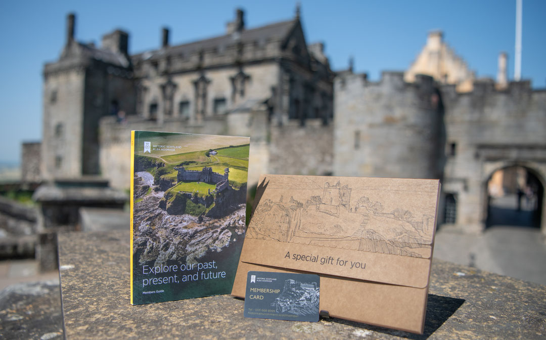 A Gift Membership pack presented on a wall with a castle in the background