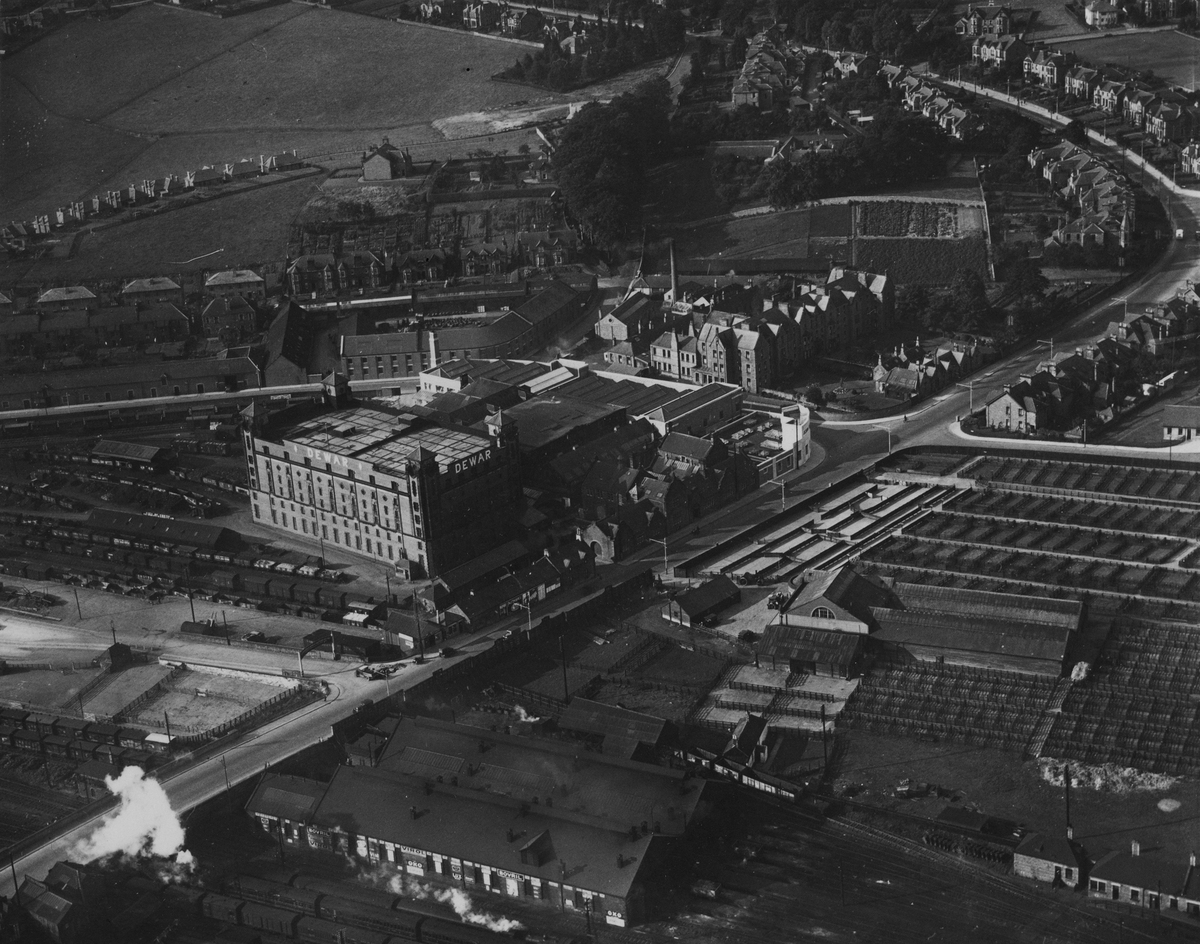 Perth, general view, showing Dewar's Distillery Glover Street Works and Graybank Road. Oblique aerial photograph taken facing south-west. 