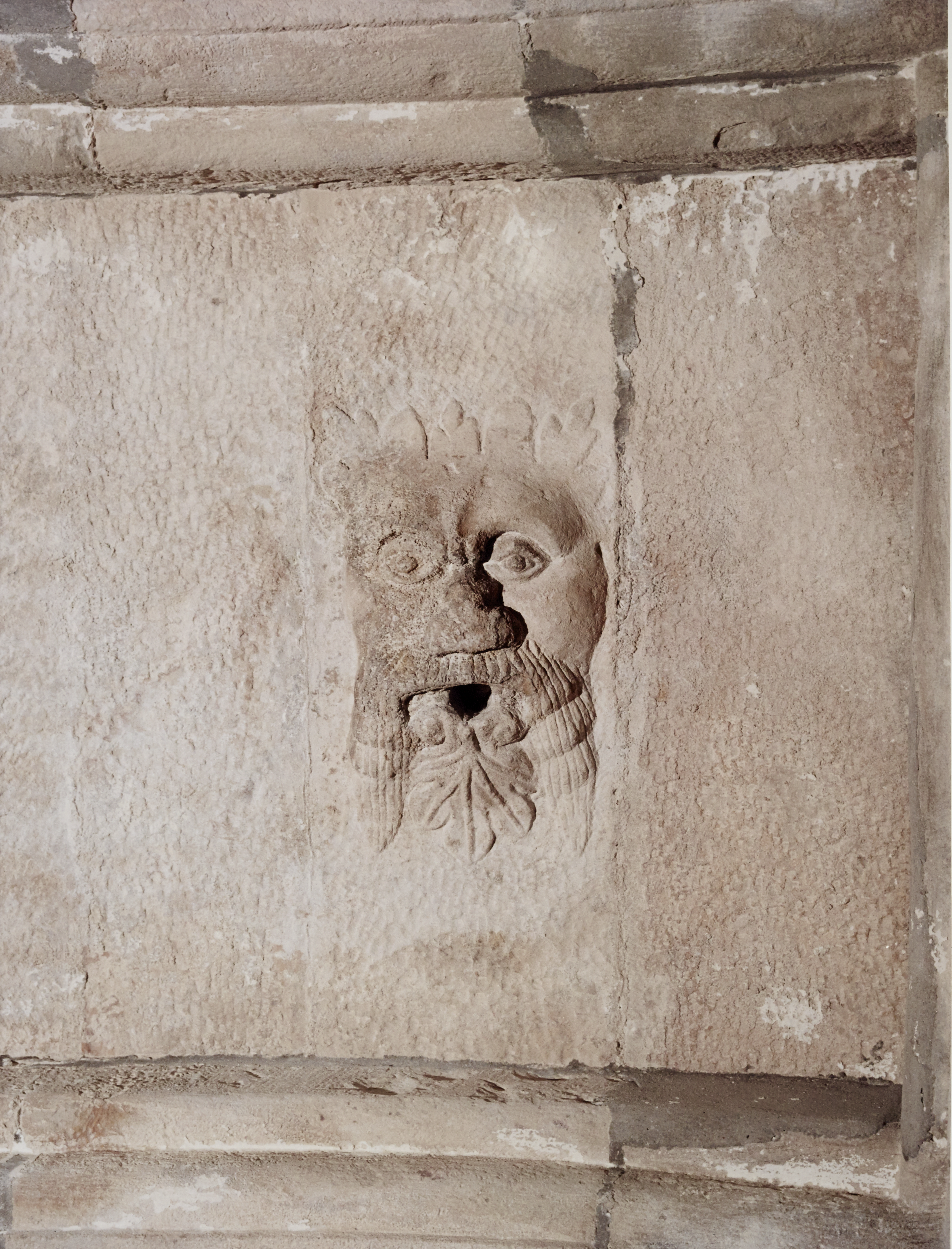 A carved face in a wall
