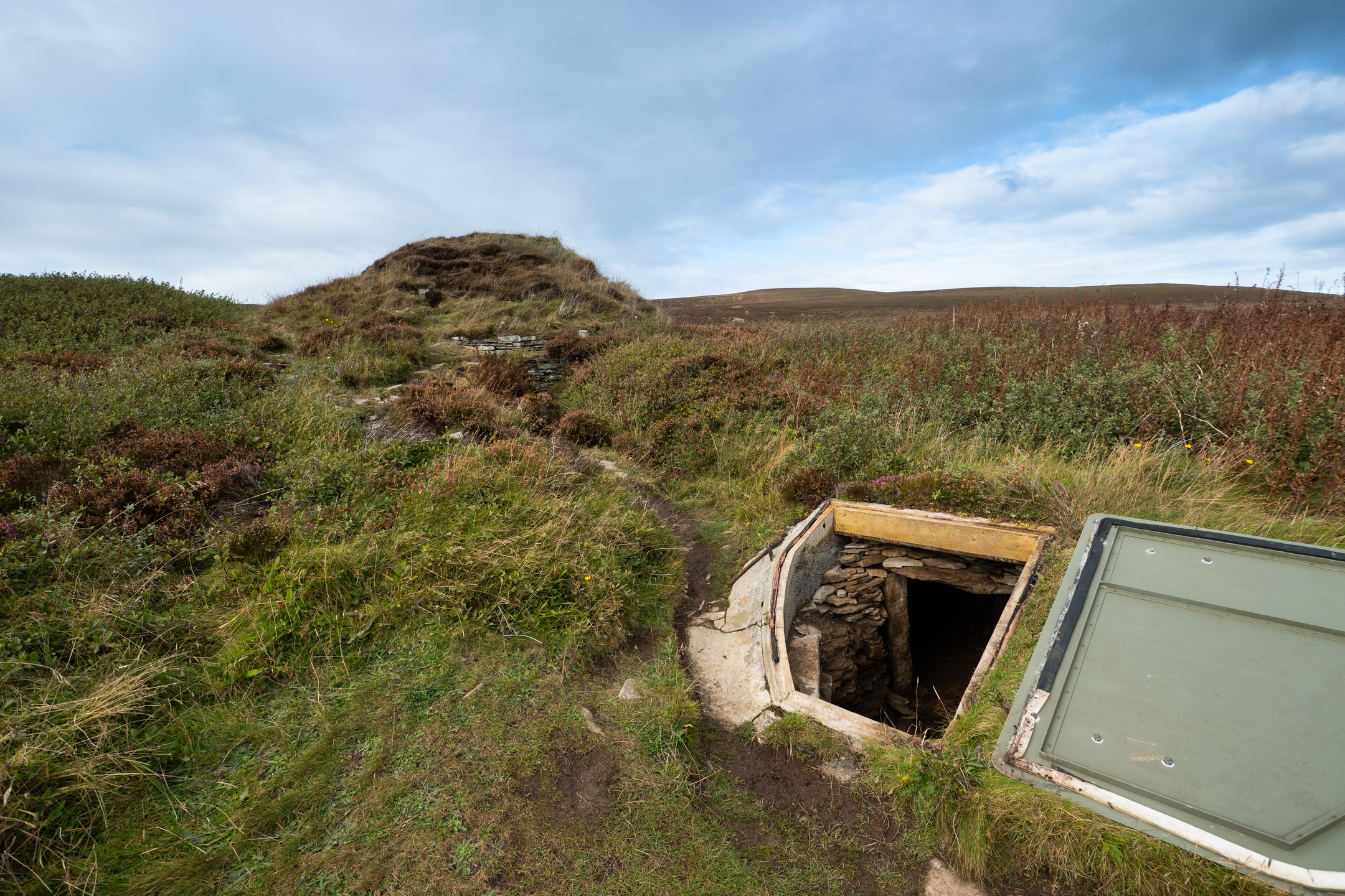 Cairn with open door and entrance in foreground