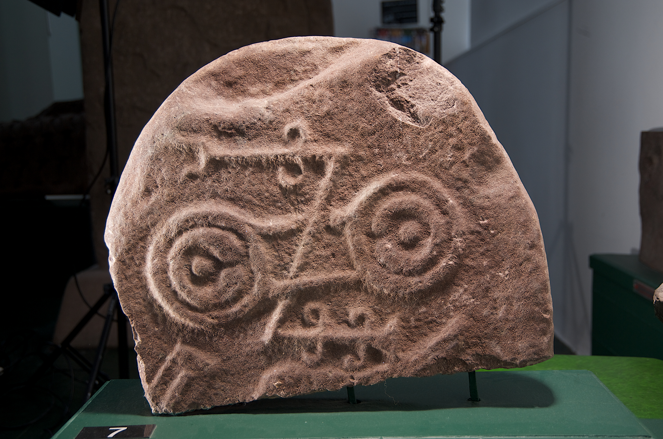 Sculptured stone with circles and lines