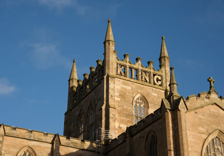 Exterior view of Melrose Abbey with blue skies 