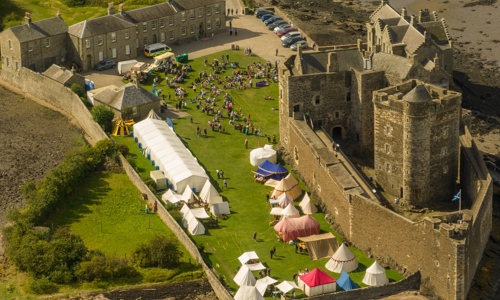 An aeriel view of Siege on the Forth with Blackness Castle in the background