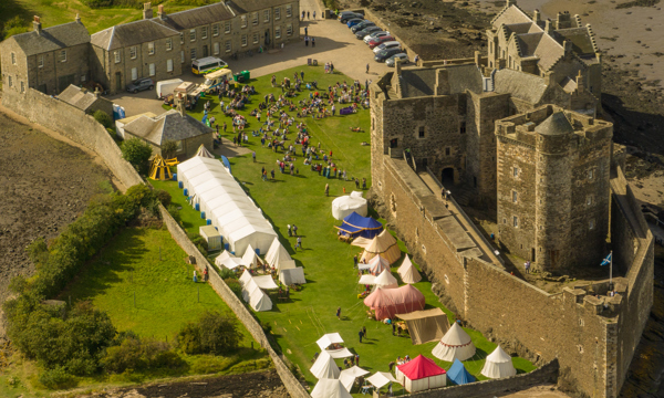 An aeriel view of Siege on the Forth with Blackness Castle in the background