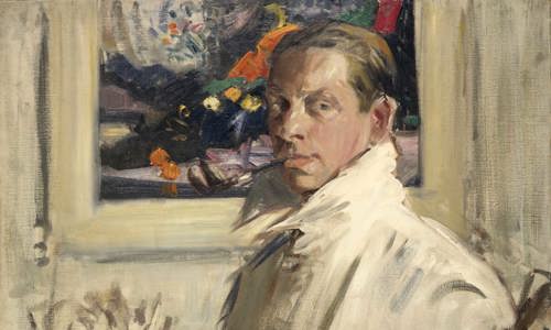 Portrait oil painting of an artist in his studio. Next to him stands a large jug filled with paint brushes, and behind is a colourful painting hanging on the wall.